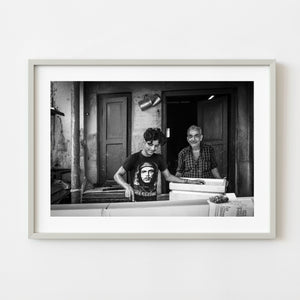 Black and white portrait of two men working in Kochi India