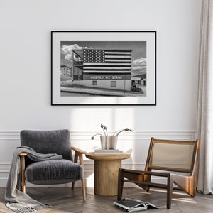 Black and white Americana photograph with painted flag and brick texture