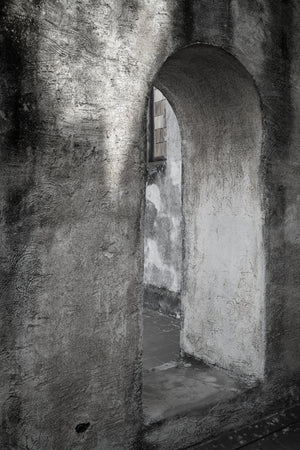 Textured arched passage inside a Havana church