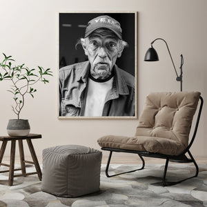 Older man's direct gaze and white mustache in black and white