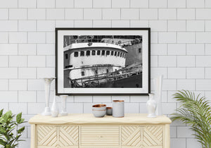 Weathered maritime vessel with railings windows and stained metal