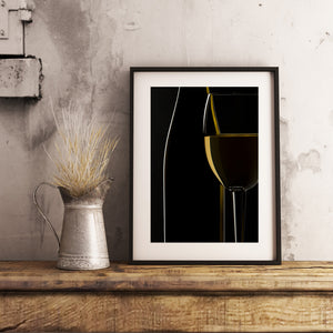 Cropped white wine glass with warm golden reflection