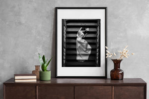 Flowing white dress contrasting with dark worn staircase