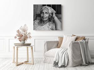 Close black and white portrait showing an Indian woman with direct eye contact