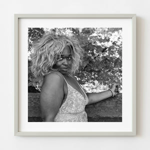 Black and white Manhattan street portrait of woman in voluminous wig