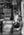 Black and white portrait of boy in Indian shop