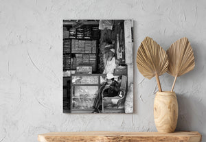 Candid Indian shop scene with two seated figures