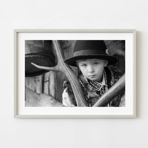 Young Romanian boy in traditional handmade clothing in black and white
