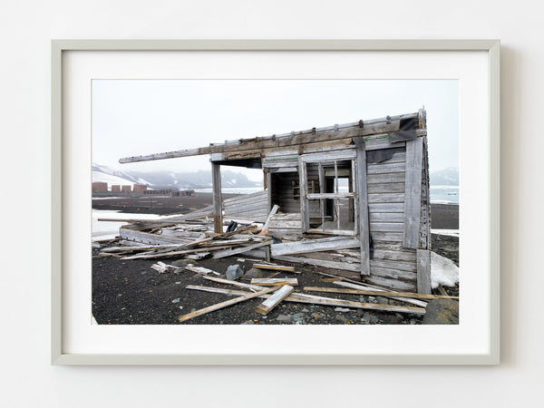Abandoned Antarctic Cabin at Whalers Bay Station Amidst Untamed Nature fine art photographic print
