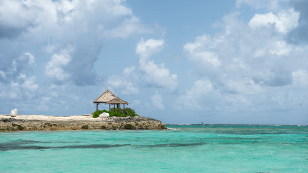 Bahamas water with tiki huts on land | Photo Art Print fine art photographic print