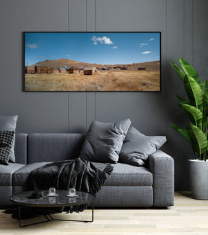 Panoramic Bodie ghost town landscape with pale grass and rounded hills