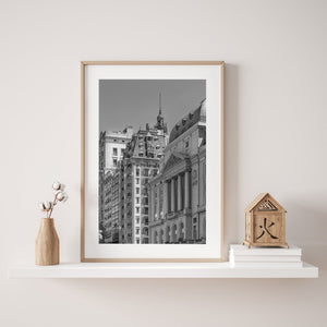 Monochrome city architecture with classical stonework and a narrow tower in Buenos Aires.