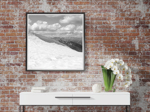 Monochrome Bugaboo landscape with textured snow and layered distant mountains.