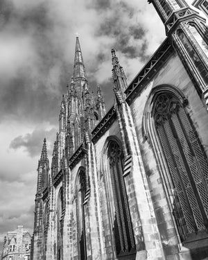 Black and white upward view of Tolbooth Church’s Gothic stonework in Edinburgh