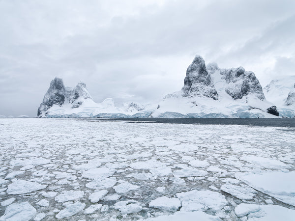 Frozen waters and textured mountains Antarctica | Photo Art Print fine art photographic print