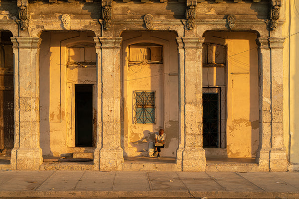 Gorgeous sunset light as a man reads a newspaper in Havana Cuba | Photo Art Print fine art photographic print