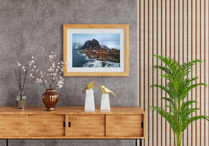A colour coastal landscape captures Hamnøy cottages beneath a dark mountain peak