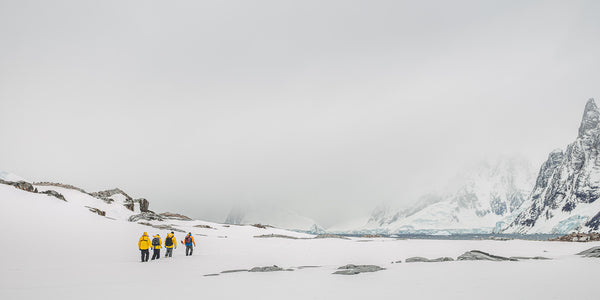 Hikers heading into the rugged and cold Antarctica landscape | Photo Art Print fine art photographic print