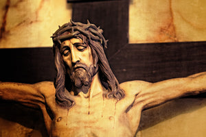 Close-up of a crucifix sculpture with a crown of thorns