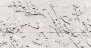 Carved battle scene with soldiers, horses and flags at Jinshanling