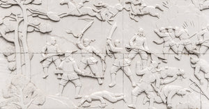 Carved battle figures with raised swords and mounted riders