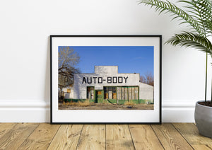 Faded AUTO-BODY lettering across an old California storefront