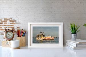 Colourful Key West houseboat floating on calm blue water