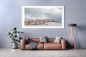 Martial Mountains landscape beneath a soft blue-grey cloudy sky