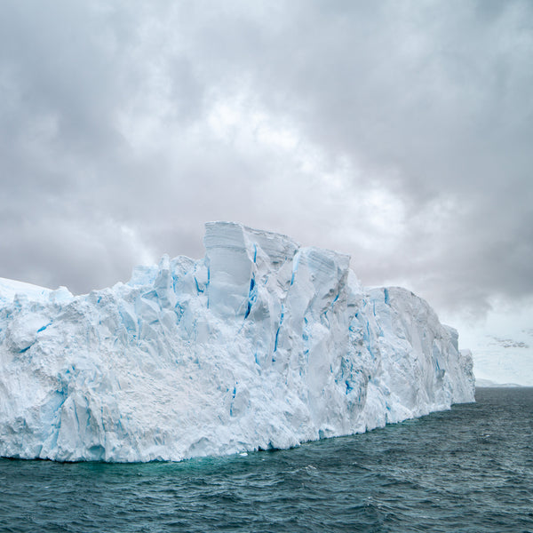 Massive iceberg with cracks and crevasses in Antarctica | Photo Art Print fine art photographic print