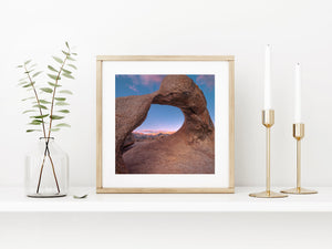 Warm light colours the Eastern Sierra through a natural rock opening