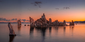 Early morning light over calm desert lake