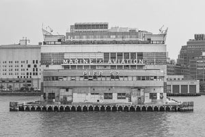New York Pier 57 viewed across the water beneath an overcast sky