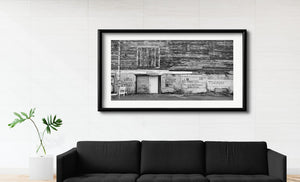 Black and white panorama of an aged Portland waterfront building