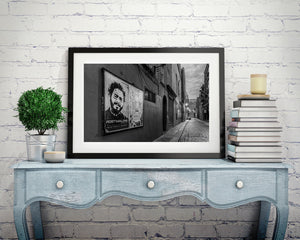 Narrow Irish street with old walls, closed shutters and cobblestones