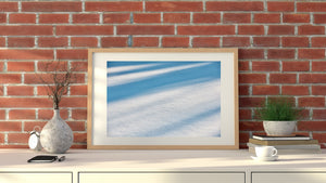 Winter surface detail with sparkling white snow and cool blue bands