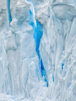 Snow and ice wall with deep blue crevasses in Antarctica | Photo Art Print fine art photographic print