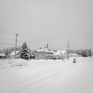 Snowmobiler driving down the road in Northern Canada | Photo Art Print fine art photographic print