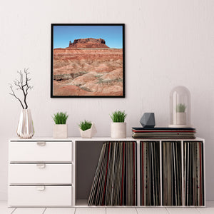 Square desert landscape beneath a clear blue sky