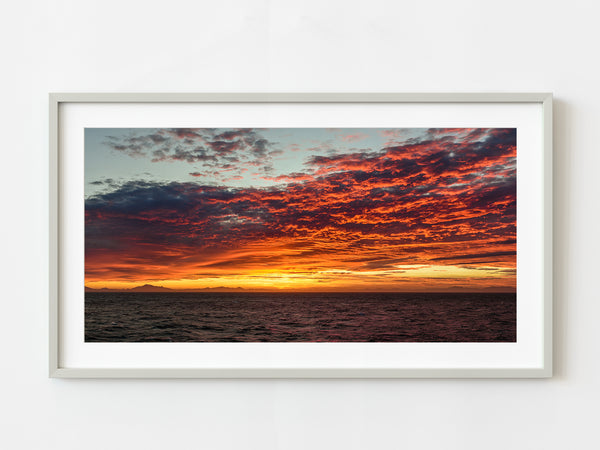 Stunning red sunset over the ocean in New Zealand | Photo Art Print fine art photographic print