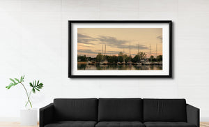 Panoramic Toronto Island marina with tall masts and calm reflections