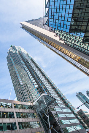Modern Toronto high-rises with reflective blue windows and converging lines