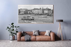 Monochrome Venice canal scene with varied vessels and ornate waterfront facades