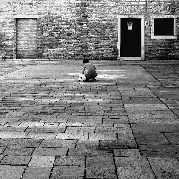 Venice boy sitting beside his football | Photo Art Print fine art photographic print