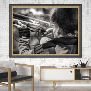 Black and white photograph of historic military reenactment musket fire.