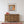 Weathered orange plaster and exposed brick around an Italian window