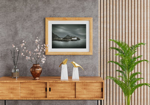 Lofoten coastal building surrounded by dark mountains and sea