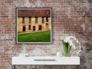 Rural French architecture with aged wooden doors and narrow windows