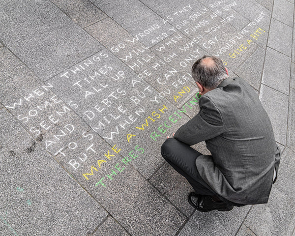 Well dressed Irishman writing message on sidewalk | Photo Art Print fine art photographic print