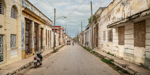 Woman cycling down the street in Cuba | Photo Art Print fine art photographic print