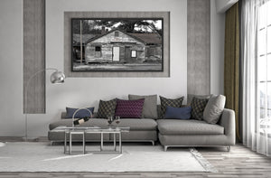 Weathered house with boarded windows and faded charm